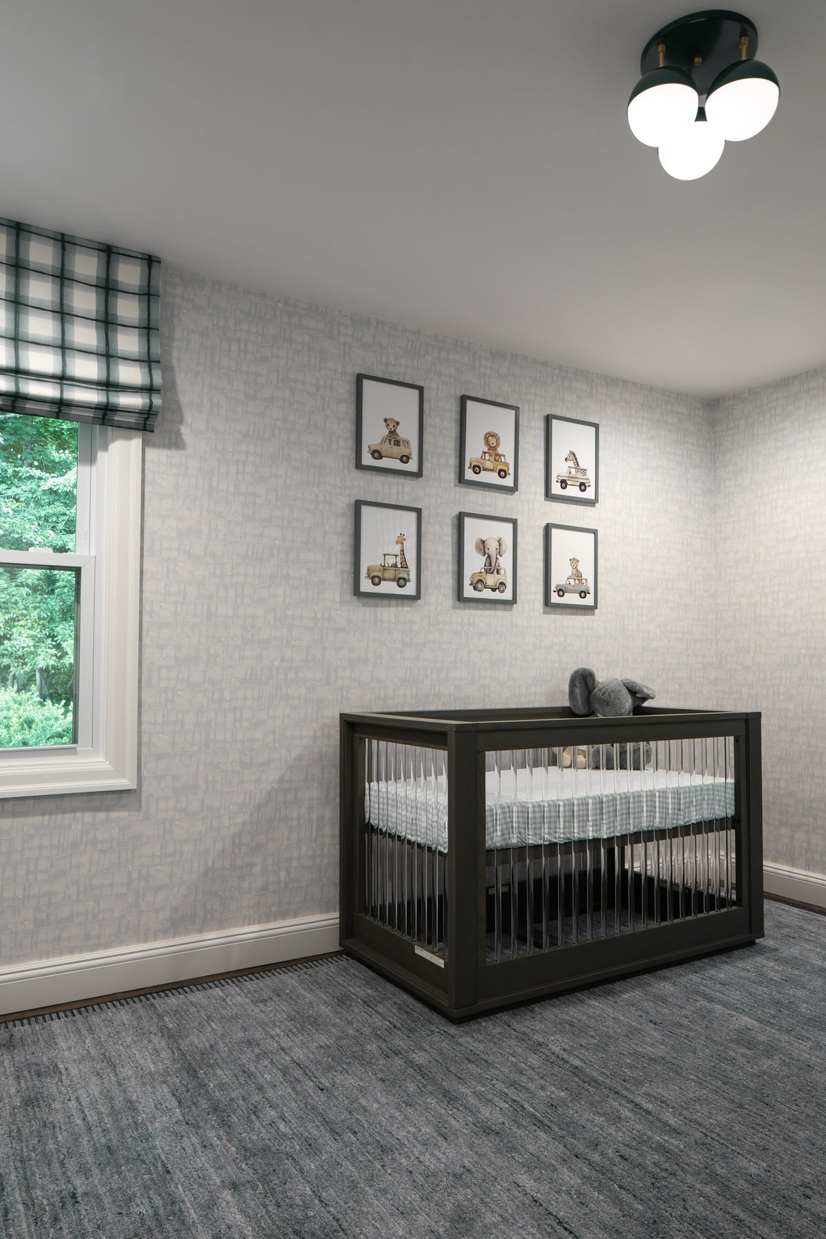 Ballsy flush mount hung in a baby nursery.