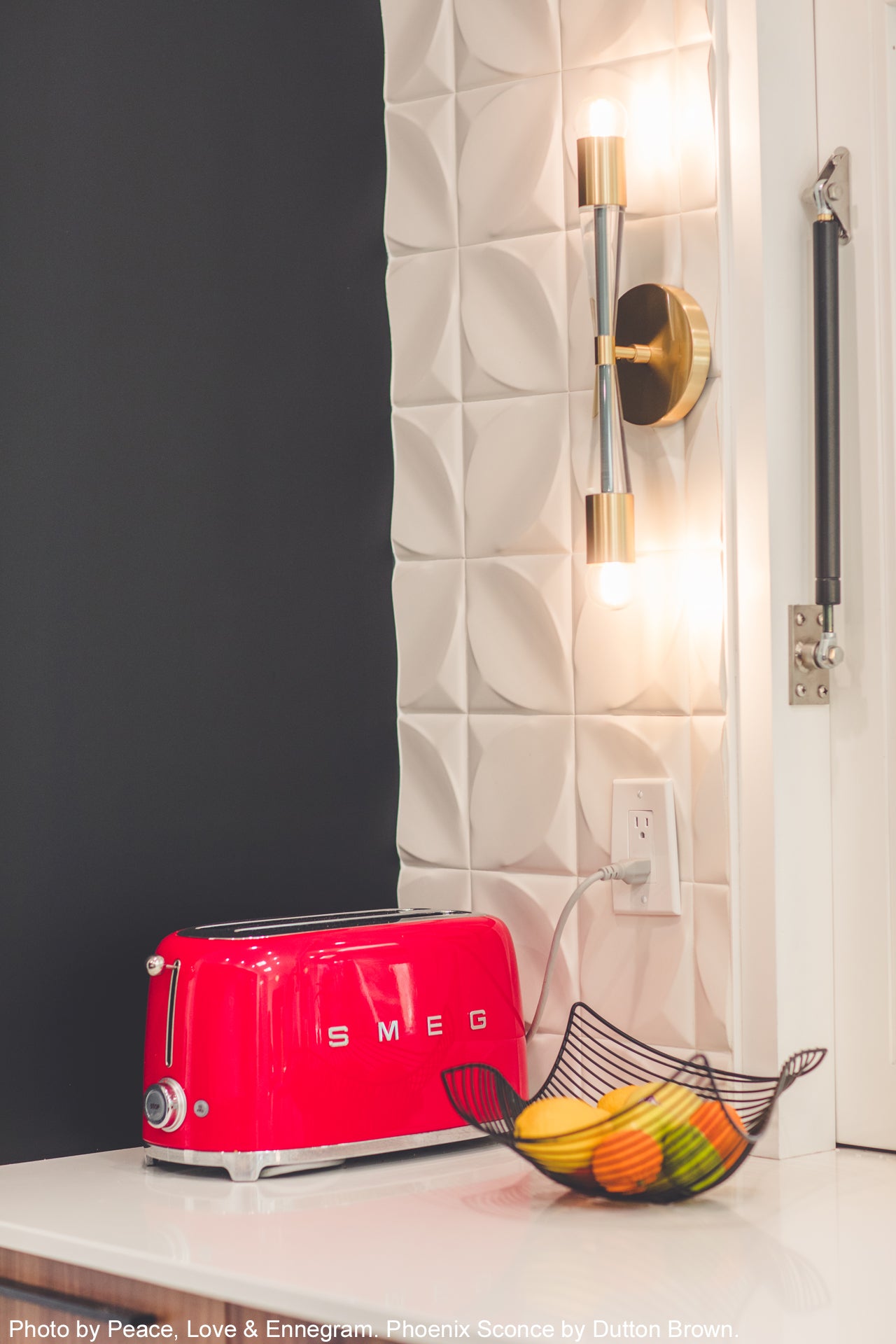 Brass and lagoon Phoenix Sconce by Dutton Brown. Photo by Peace, Love & Ennegram.