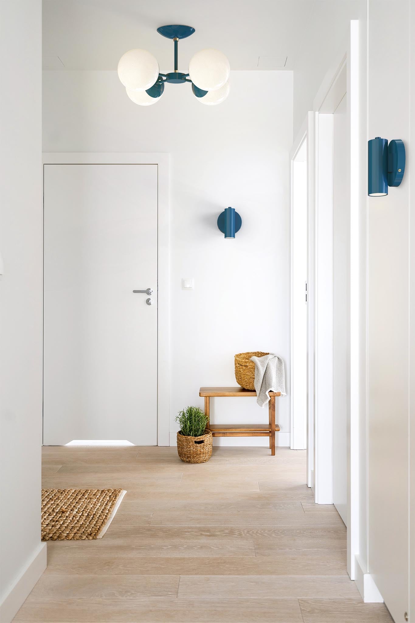 Brass and slate blue color display sconce hallway scene dutton brown lighting