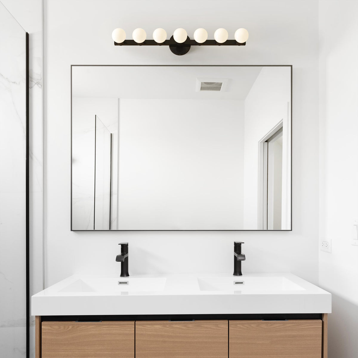 black and black color Vogue 7 wall sconce light dutton brown bathroom scene