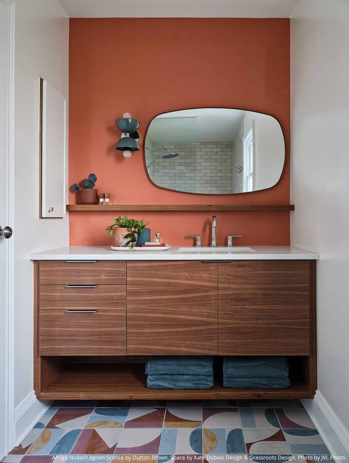 Nickel and lagoon color Amigo sconce by Dutton Brown. Space by Kate Dubois Design. Photo by JVL Photo.