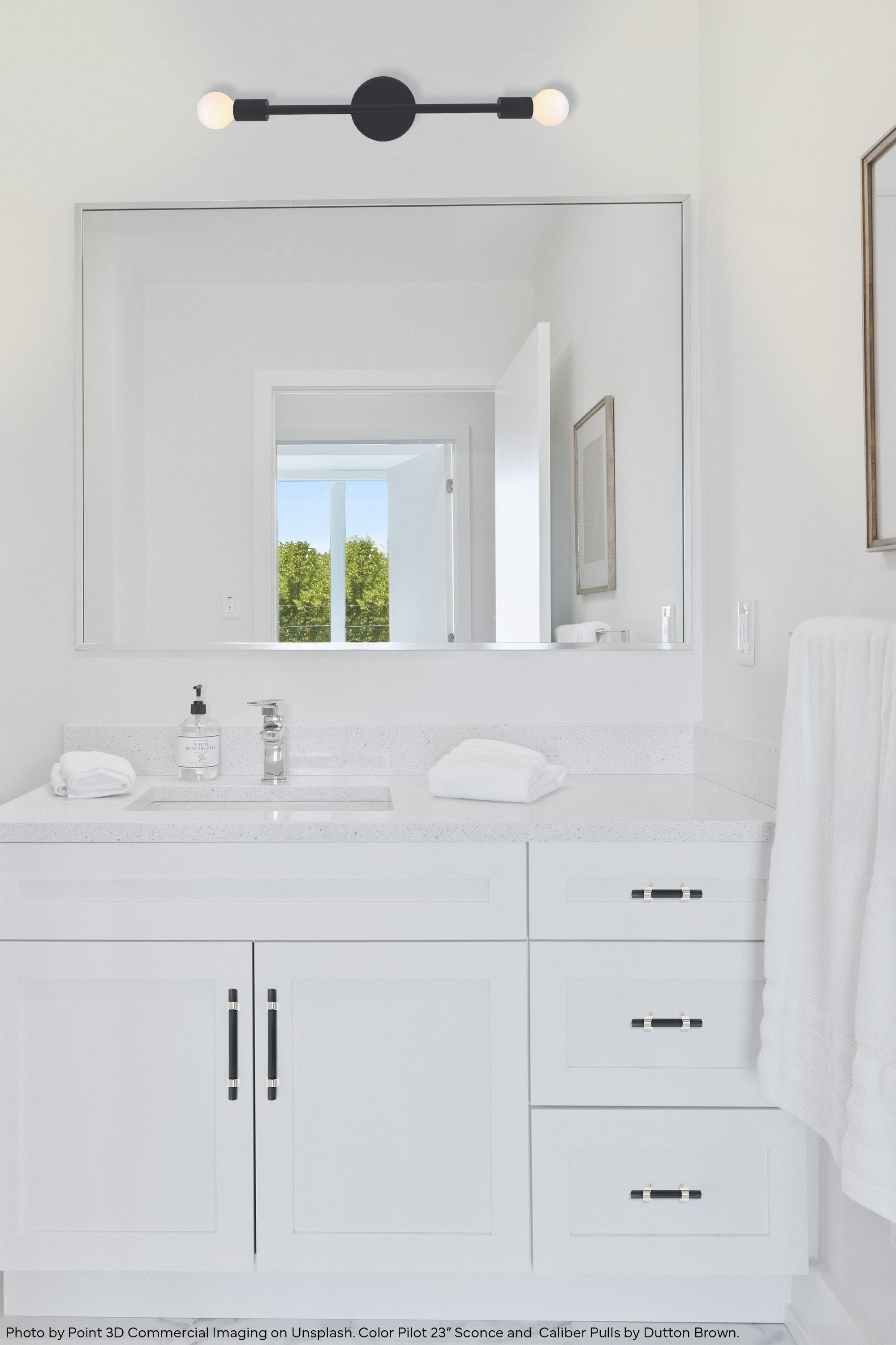 Black and black color Pilot Sconce 23" by Dutton Brown. Photo by Point 3D Commercial Imaging via Unsplash. _hover