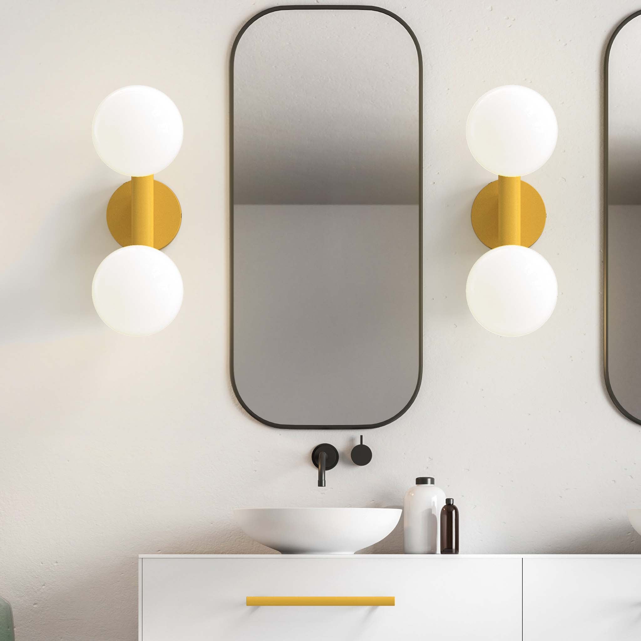 Icon 2 sconce in Ochre in a bathroom 