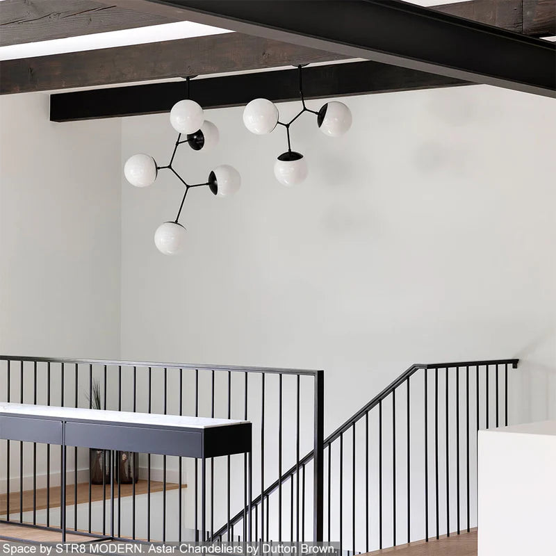Black color Astar chandeliers by Dutton Brown. Space and photo by STR8 MODERN