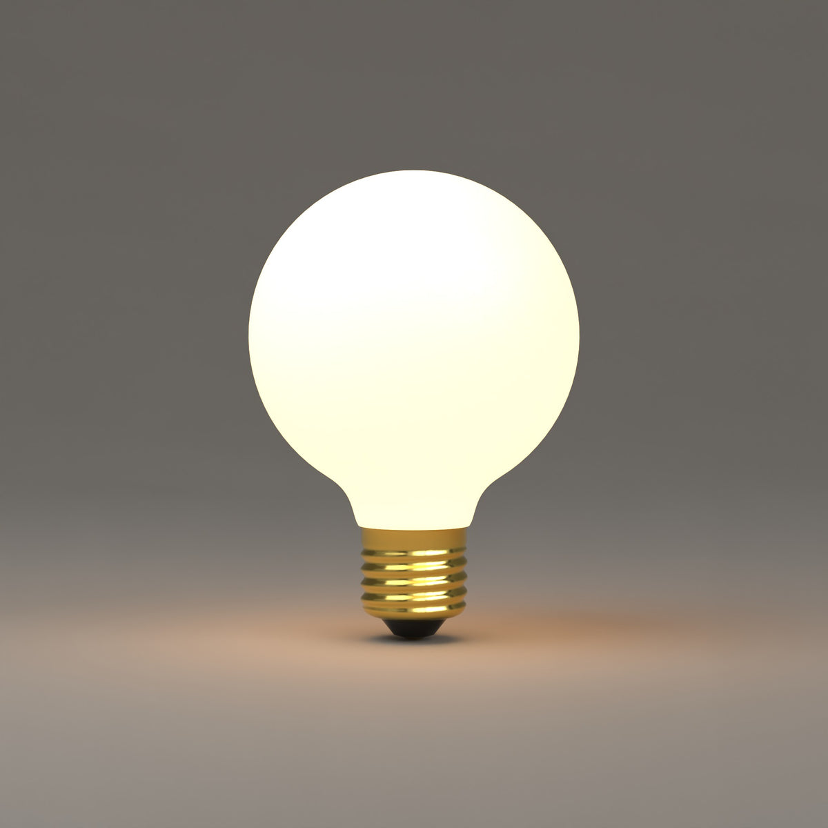 LED G25 Bulb - Matte White lit, glowing warm white at 3000K. Dutton Brown lighting