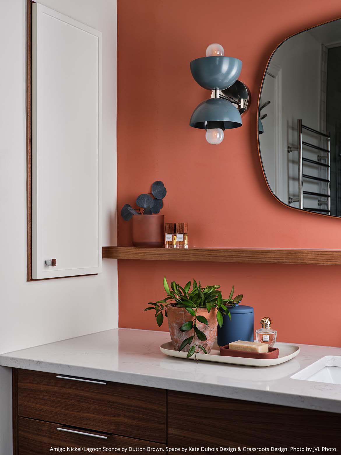 Nickel and lagoon color Amigo sconce by Dutton Brown. Space by Kate Dubois Design. Photo by JVL Photo.