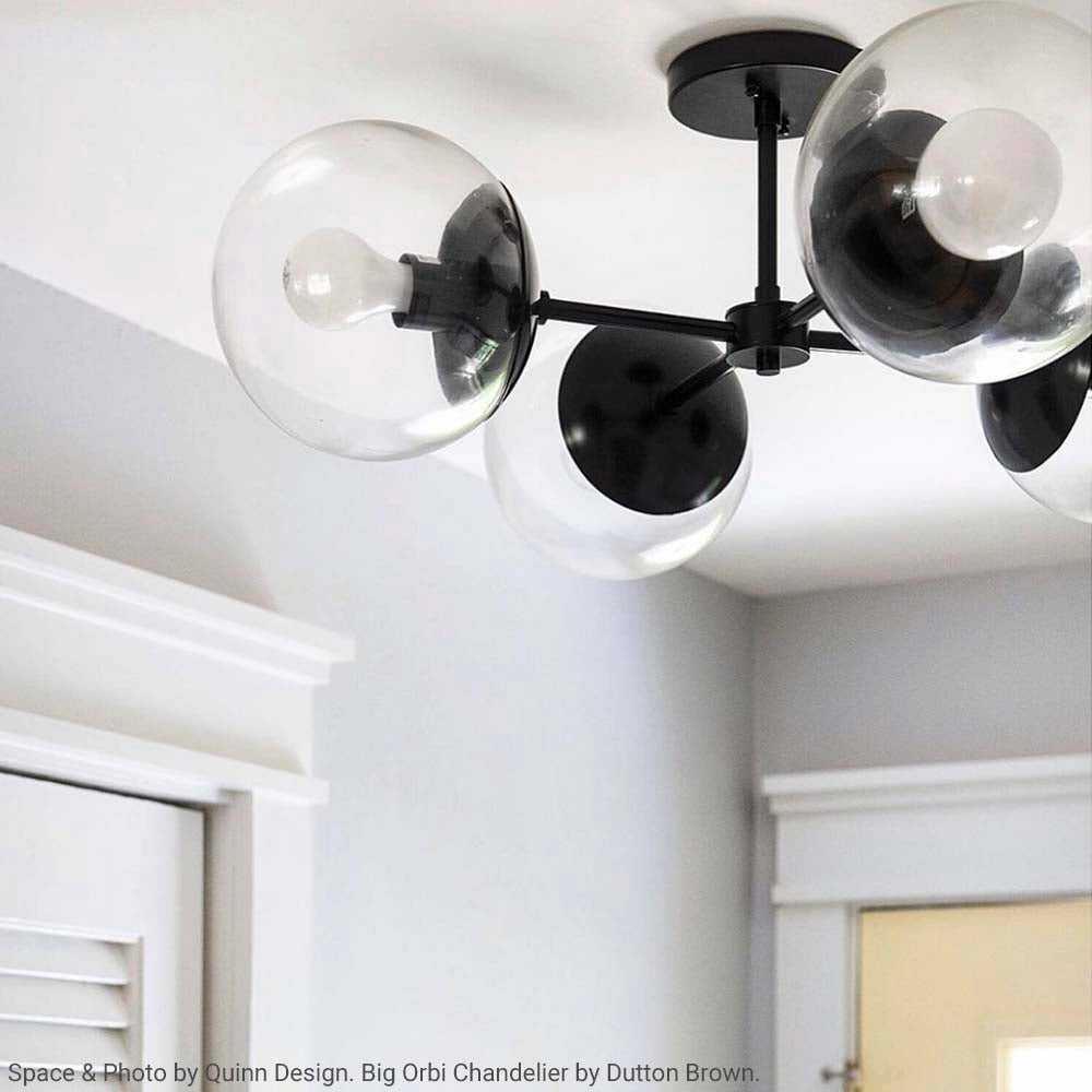 Black and black color Big Orbi flush mount by Dutton Brown. Space and photo by Quinn Design
