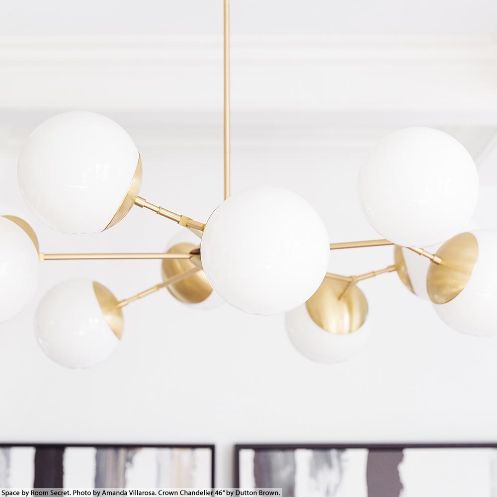 Brass Crown chandelier 46" by Dutton Brown. Space by Room Secret. Photo by Amanda Villarosa.