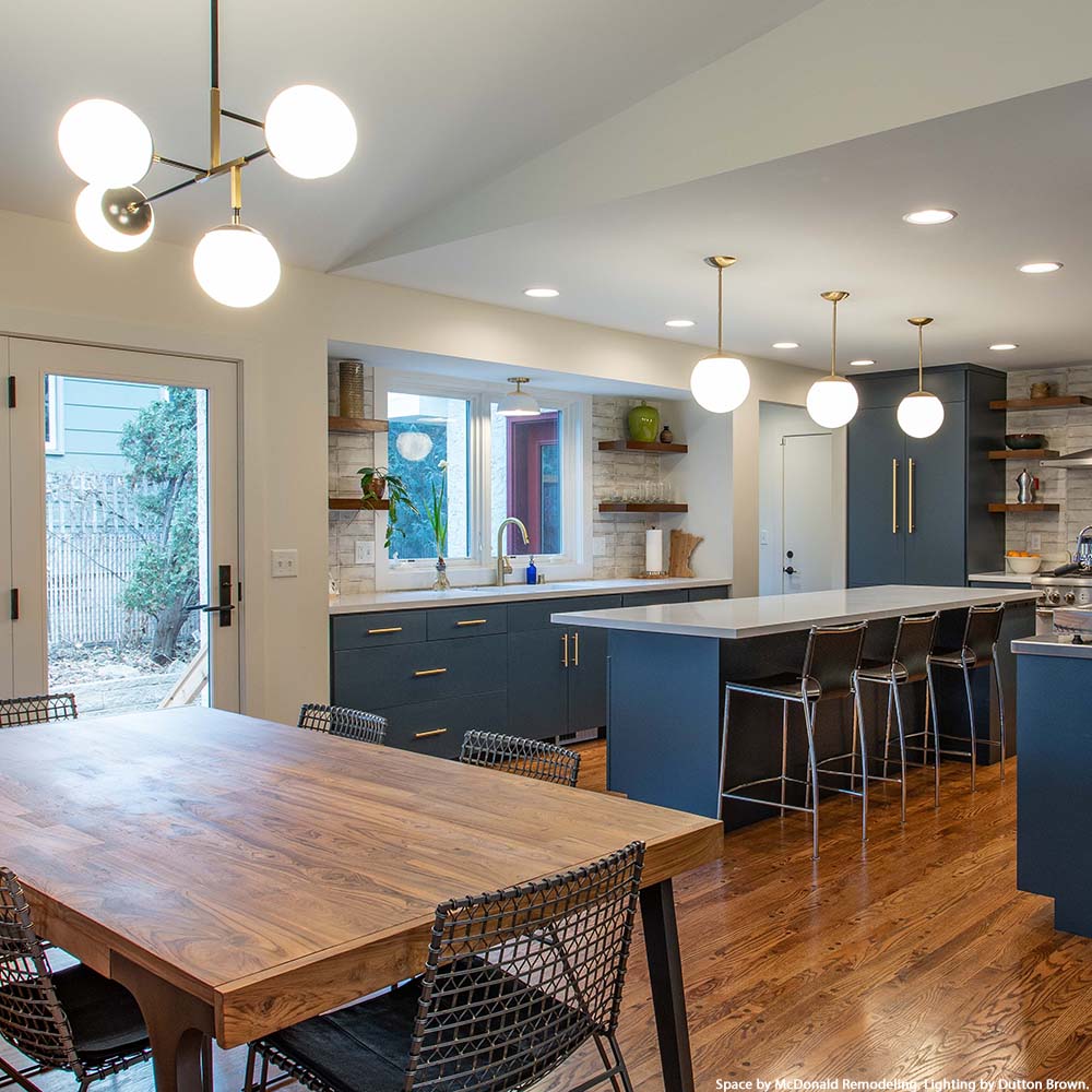Black and brass Prisma chandelier 35" by Dutton Brown. Space by McDonald Remodeling.