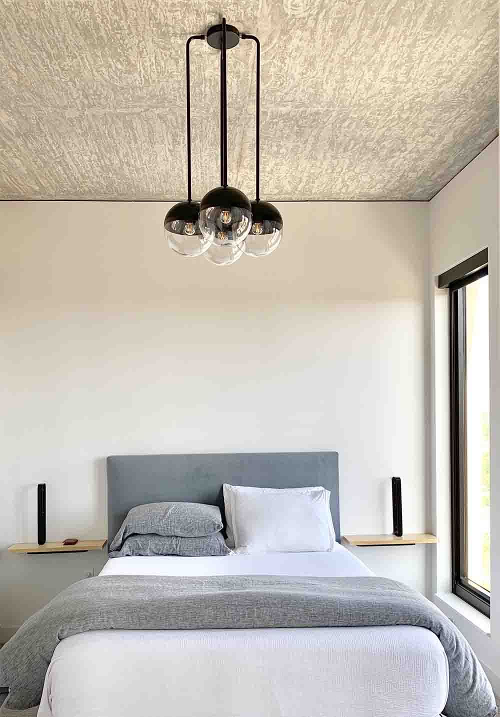 Nickel and black color Reign chandelier by Dutton Brown. _hover